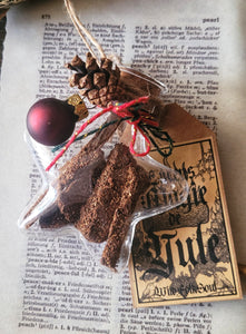 Entirely handmade Yule stick incense in its hanging vial 